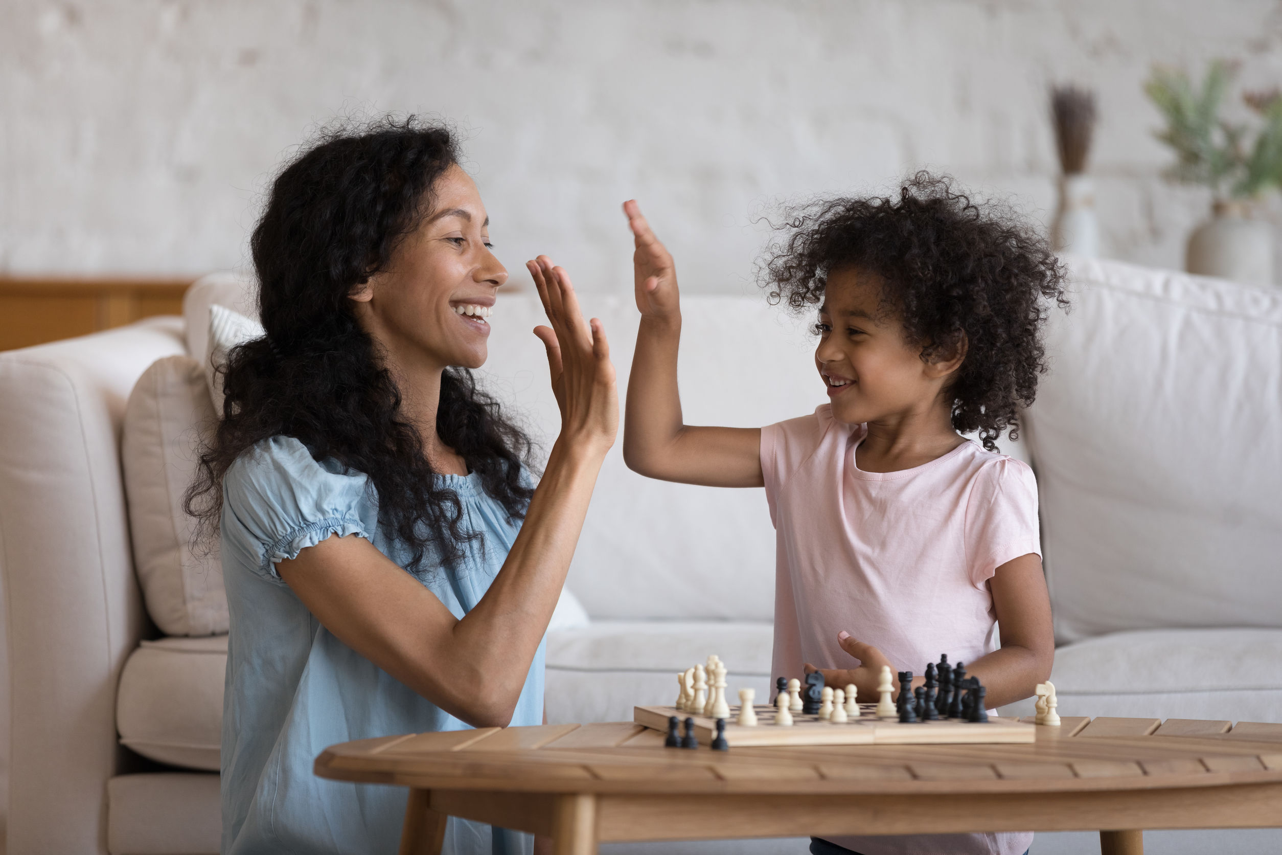 child celebrating after playing a game