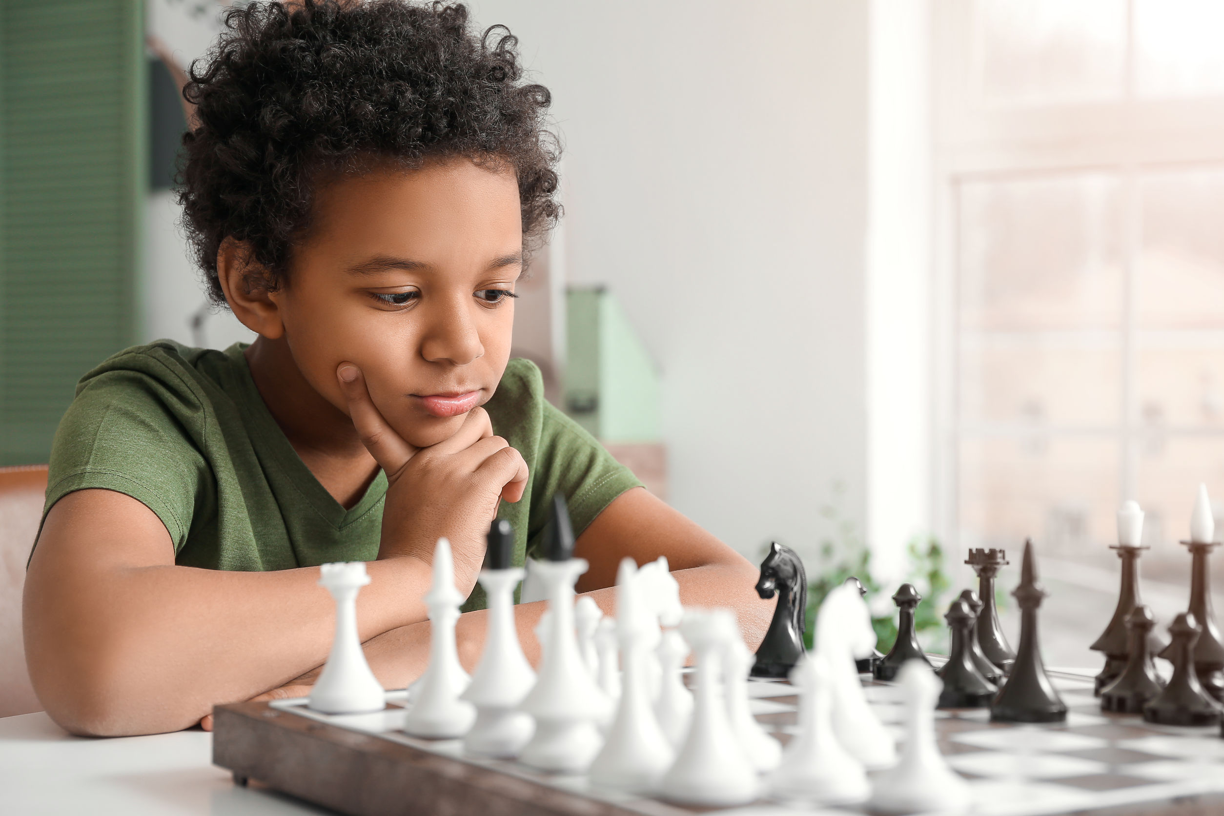 Child engaged in activities that require problem-solving, illustrating the application of emotional intelligence in learning and development.