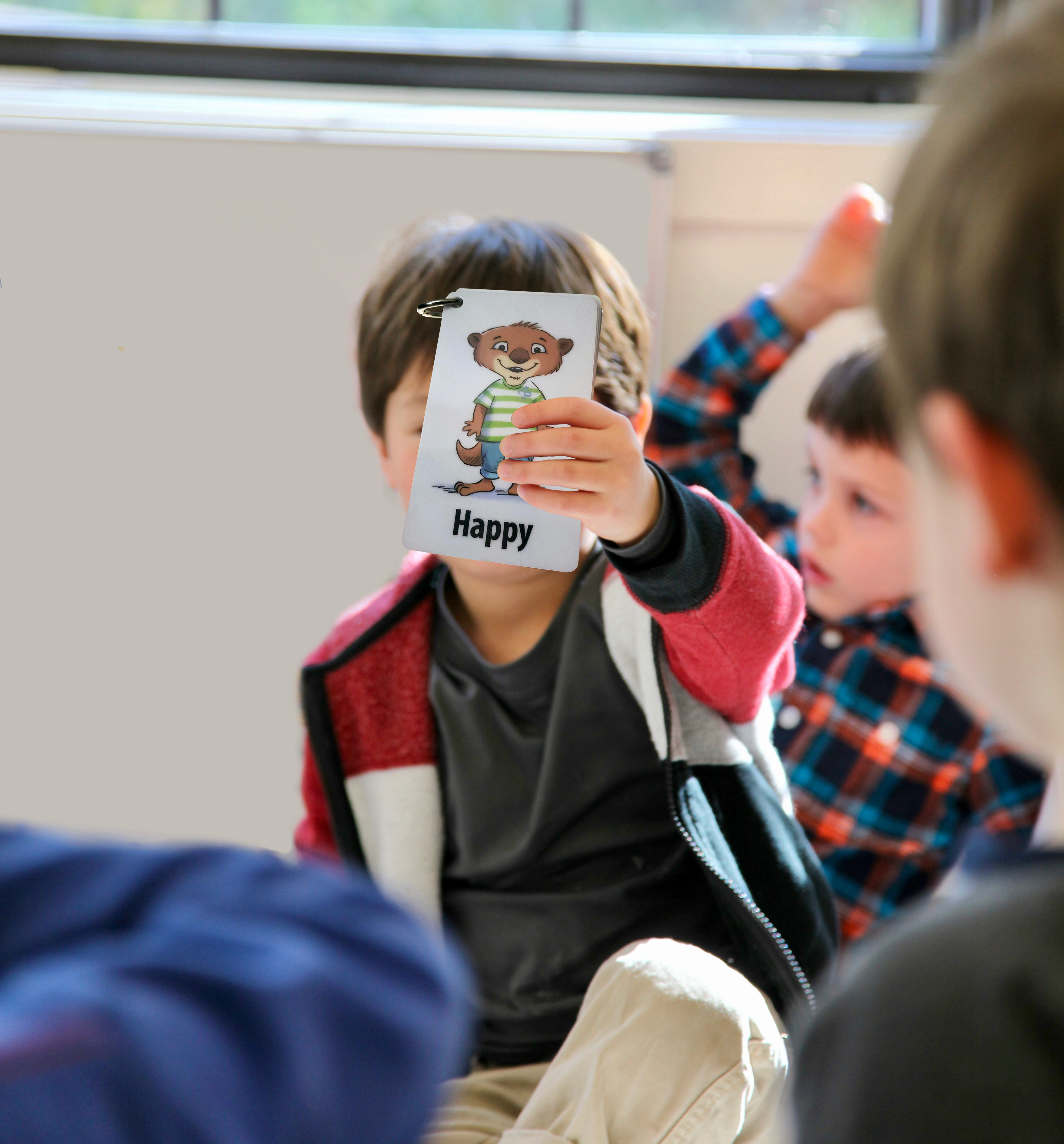 Boy identifying his emotions using Our Emotions Cards